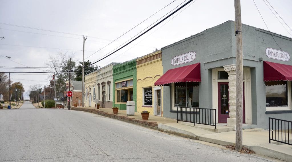 Historic downtown Byhalia, MS, featuring small-town charm, colorful storefronts, and a welcoming community. Professional lawn care services available in Byhalia and surrounding Mid-South areas