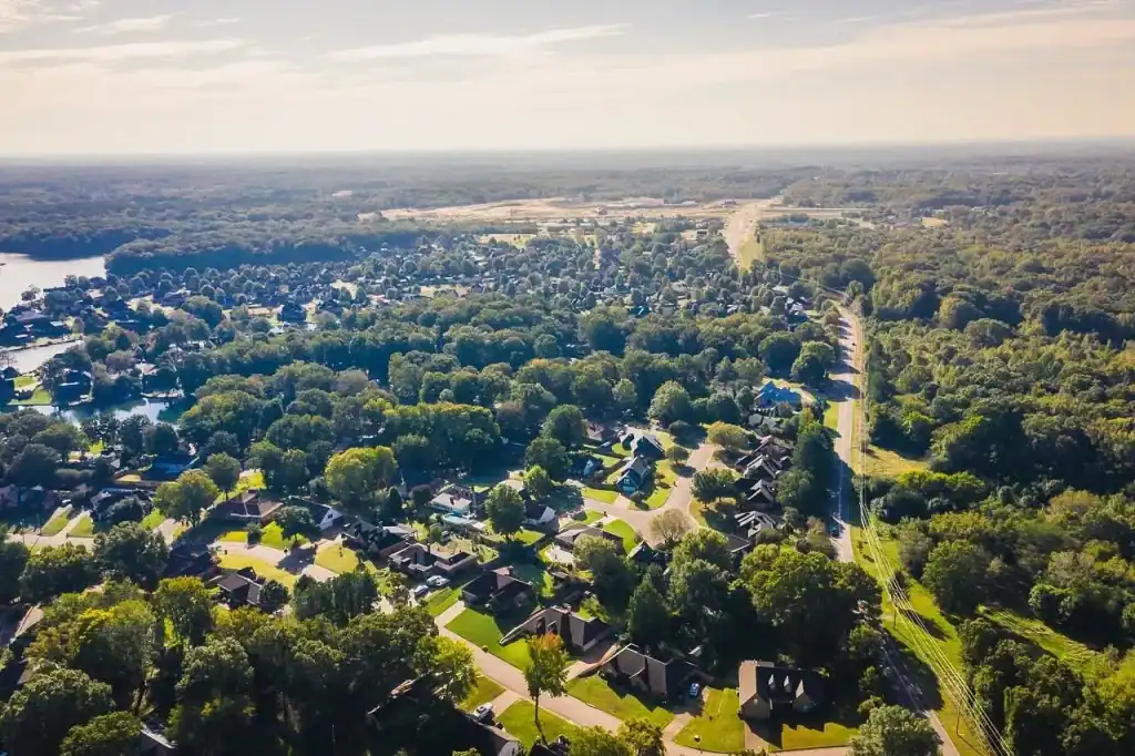 Aerial view of Lakeland, TN, showcasing lush greenery, residential neighborhoods, and well-maintained landscapes. Professional lawn care services available in Lakeland and surrounding Mid-South areas.